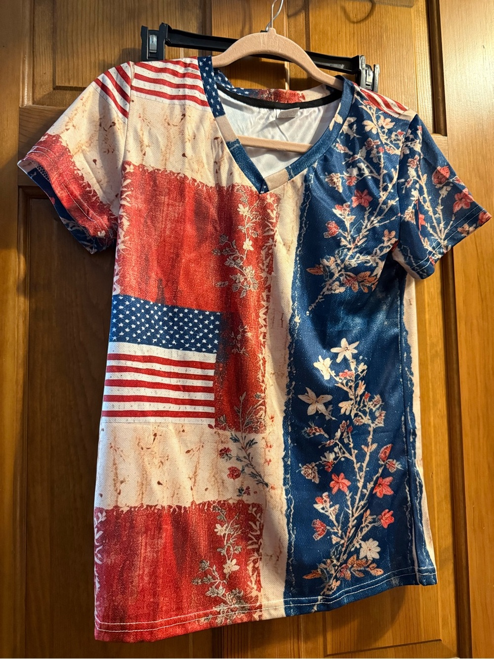 Woman’s NWOT medium V‑Neck Tee in Red, White & Blue Floral Flag Print